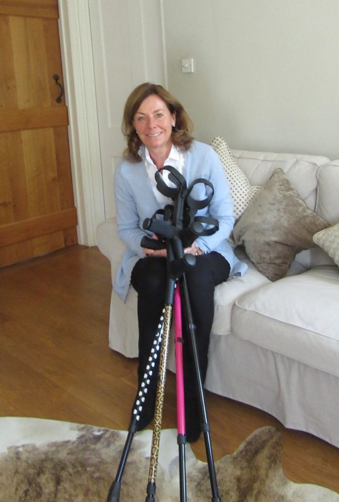 A photo of Amelia's mum Clare holding 4 pair of Cool Crutches