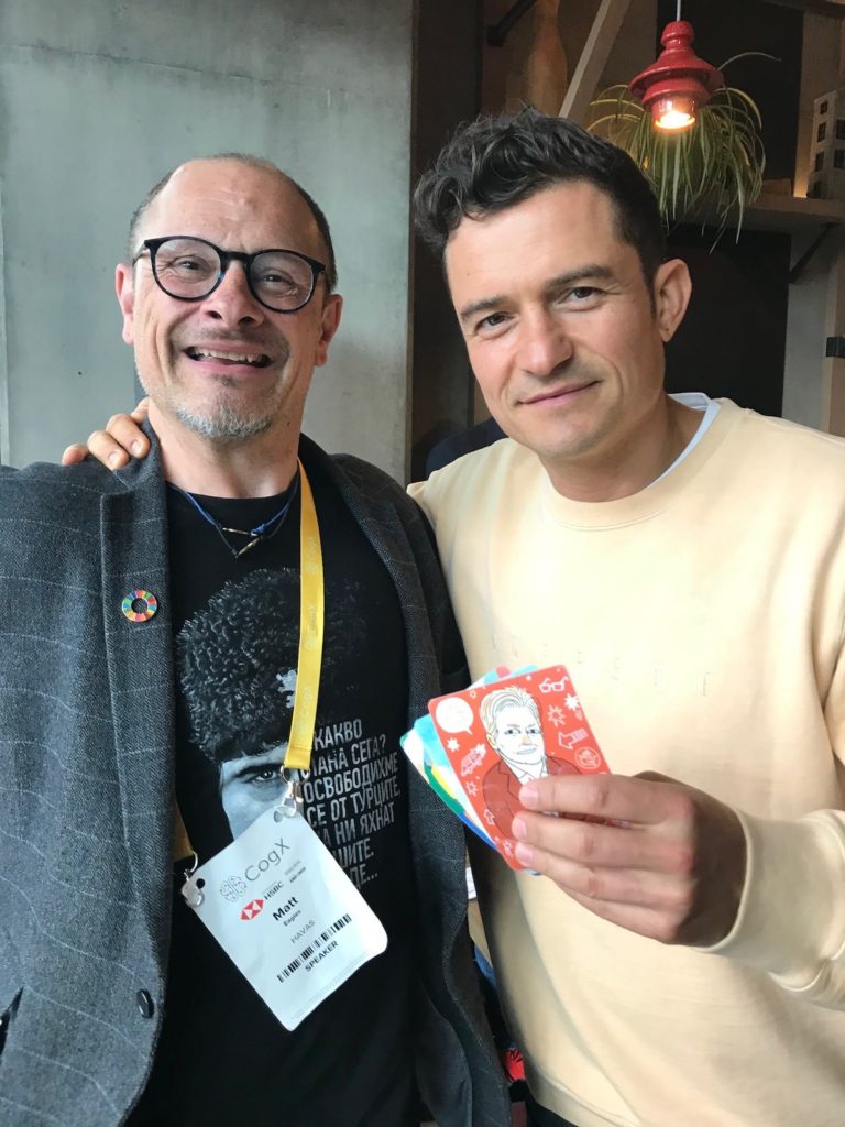 Matt with Orlando Bloom, showing off some Parkycards